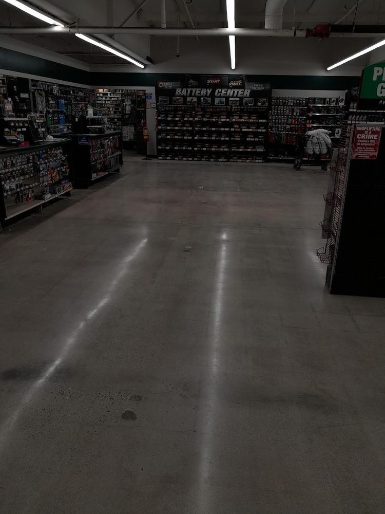 An empty store with a sign that says battery center