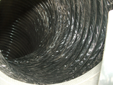 a close up of a black hose with a hole in the middle