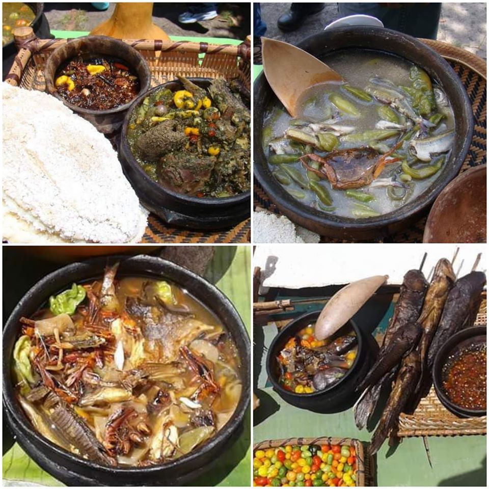 Mesas del Restaurante Aguacero en H2Otel en playa El Agua, con mantelería blanca y decoración elegante.