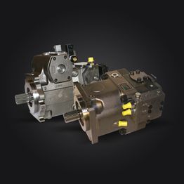 Deux pompes hydrauliques sont assises l'une à côté de l'autre sur un fond noir.