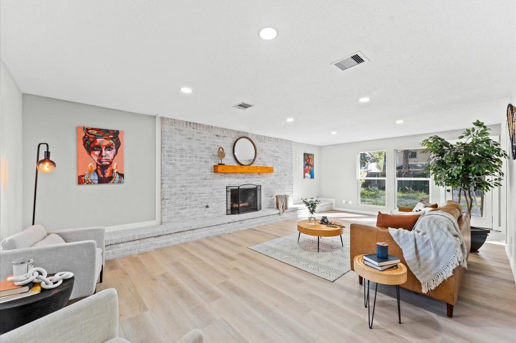 A living room filled with furniture and a fireplace.