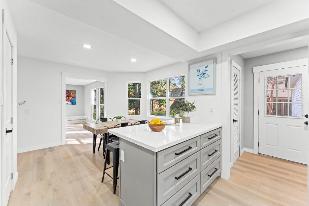 There is a large island in the middle of the kitchen.