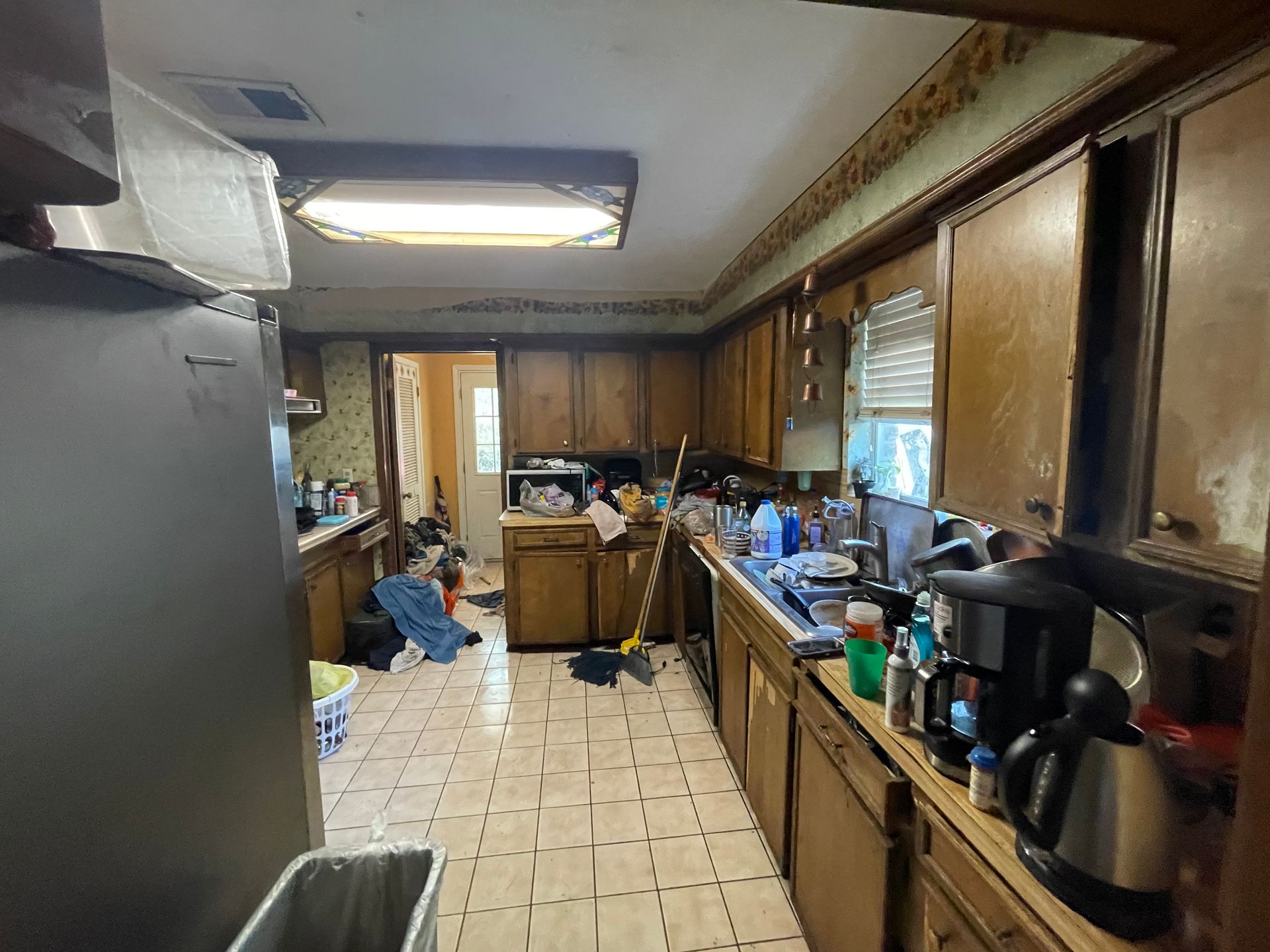 A kitchen with a lot of appliances and cabinets