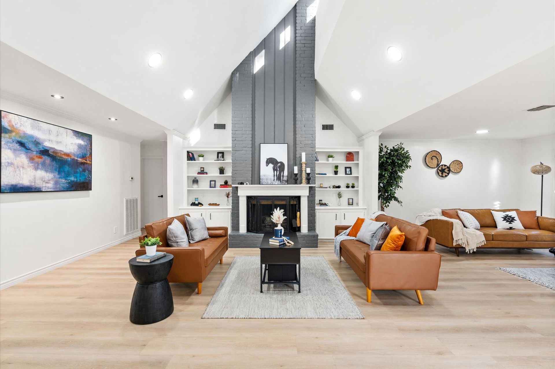 A living room filled with furniture and a fireplace.