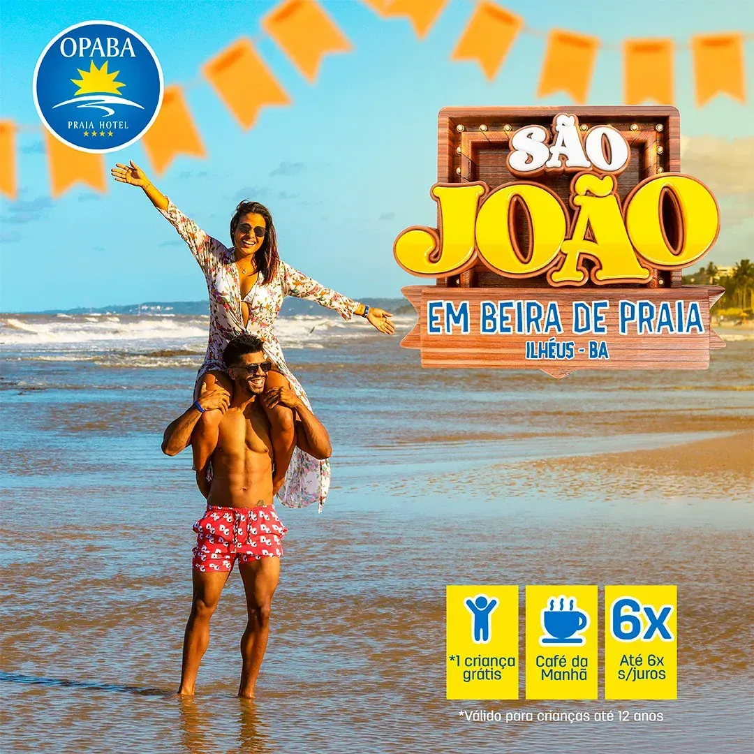 Um homem está carregando uma mulher nos ombros na praia