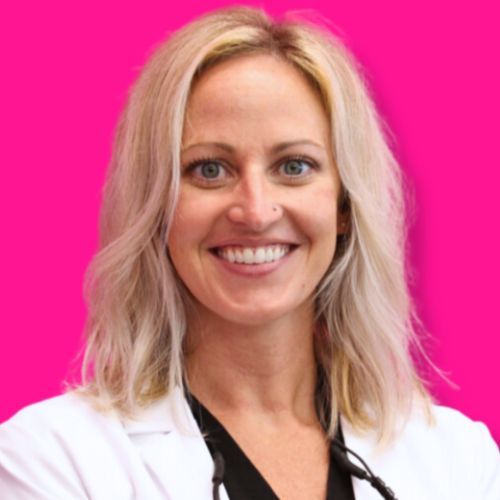 A headshot of a smiling person wearing a white lab coat and dark top against a bright pink background.