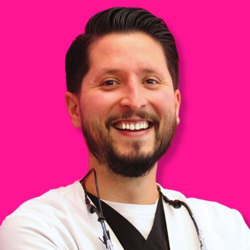 A smiling person in professional medical attire with a black lanyard against a solid, vibrant pink background.