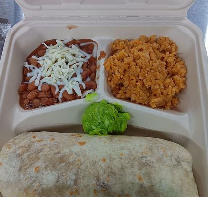 Lunch container with a burrito, beans with cheese, rice, and guacamole.