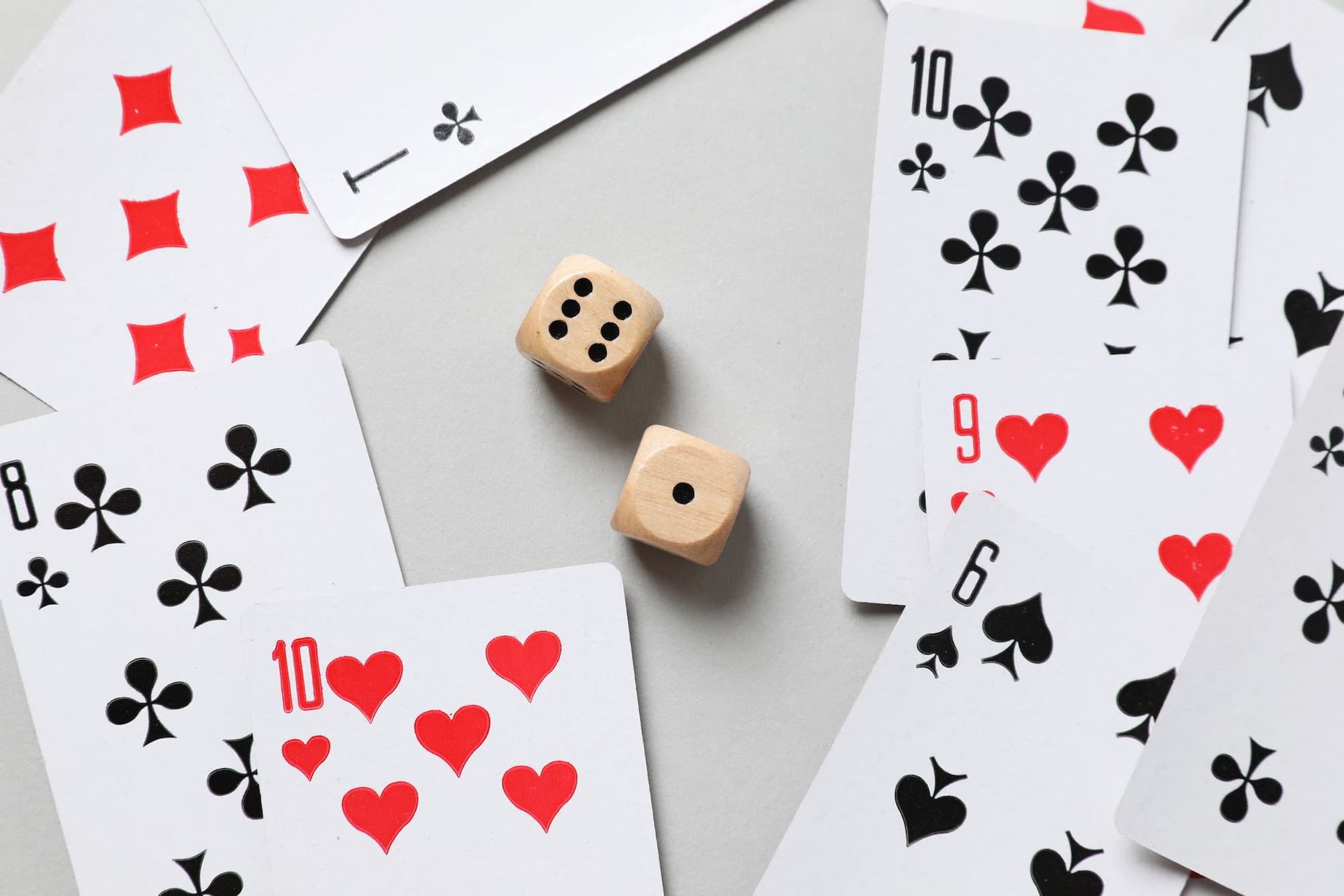 Two dice and playing cards.