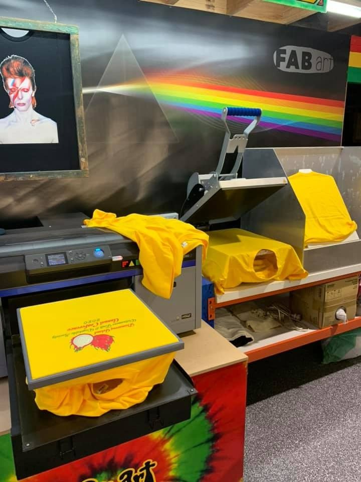A Yellow Shirt is Being Printed on a Machine — Fab Art in Taree, NSW