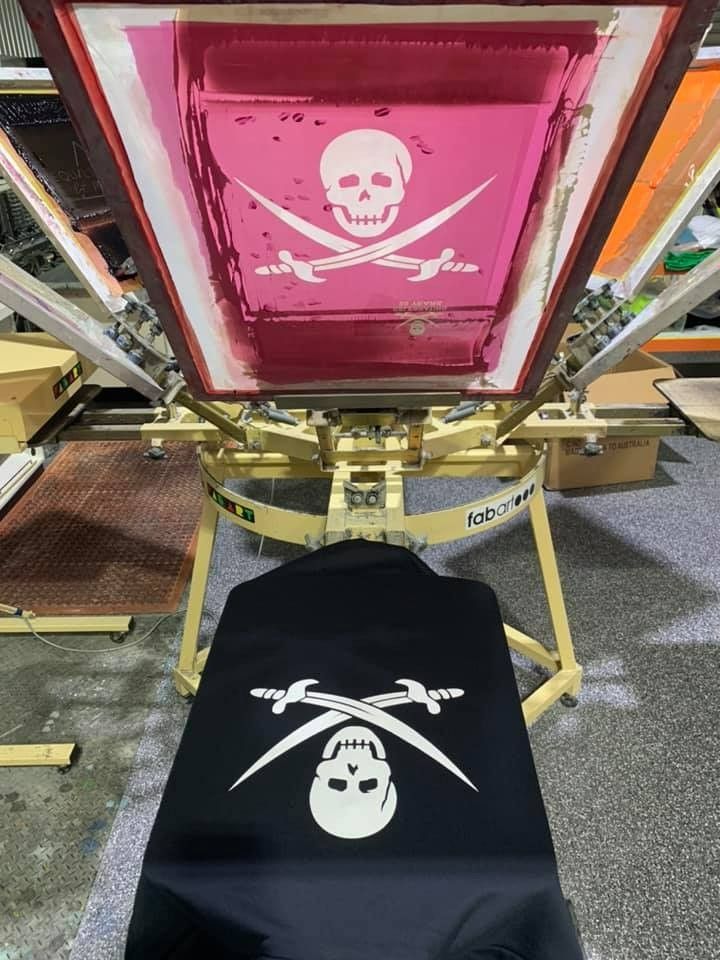 A Black Shirt With a Skull and Crossbones on It is Being Printed — Fab Art in Wallabi Point, NSW