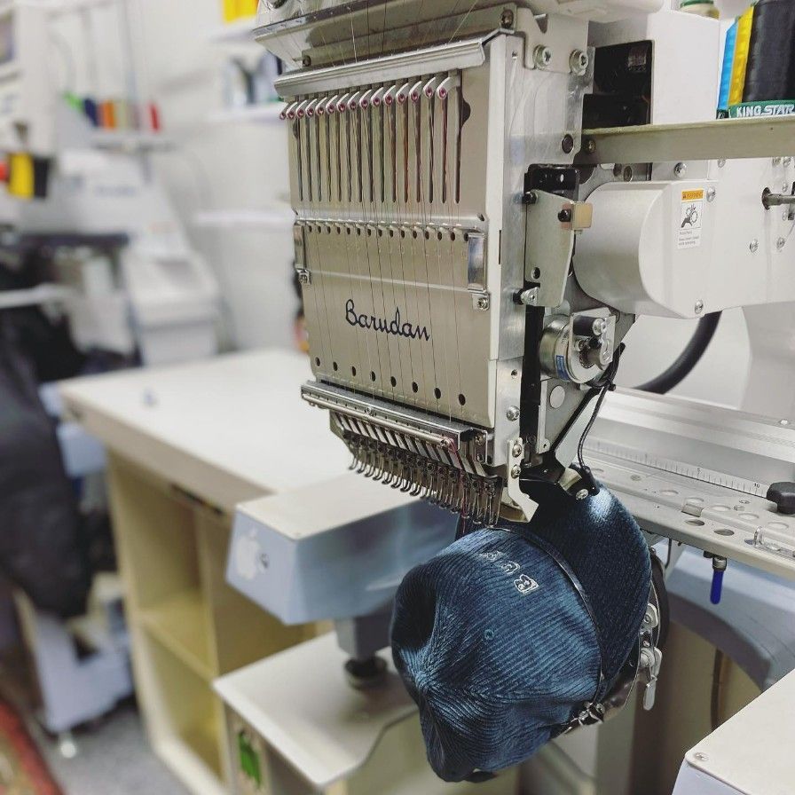 A Baseball Cap is Being Embroidered on a Machine — Fab Art in Taree, NSW