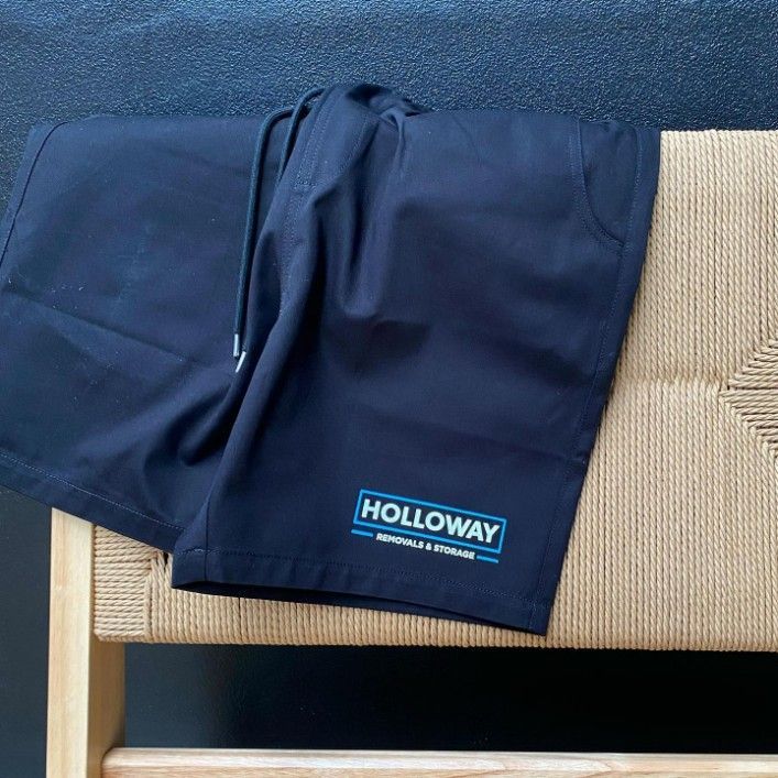 A Pair of Holloway Shorts Are Sitting on a Wooden Bench — Fab Art in Wallabi Point, NSW