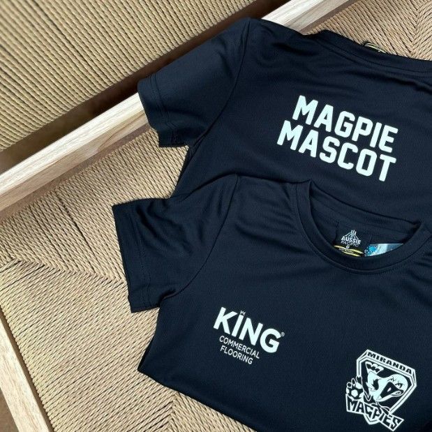 Two Black T-shirts With Magpie Mascot and King Written on Them — Fab Art in Forster, NSW