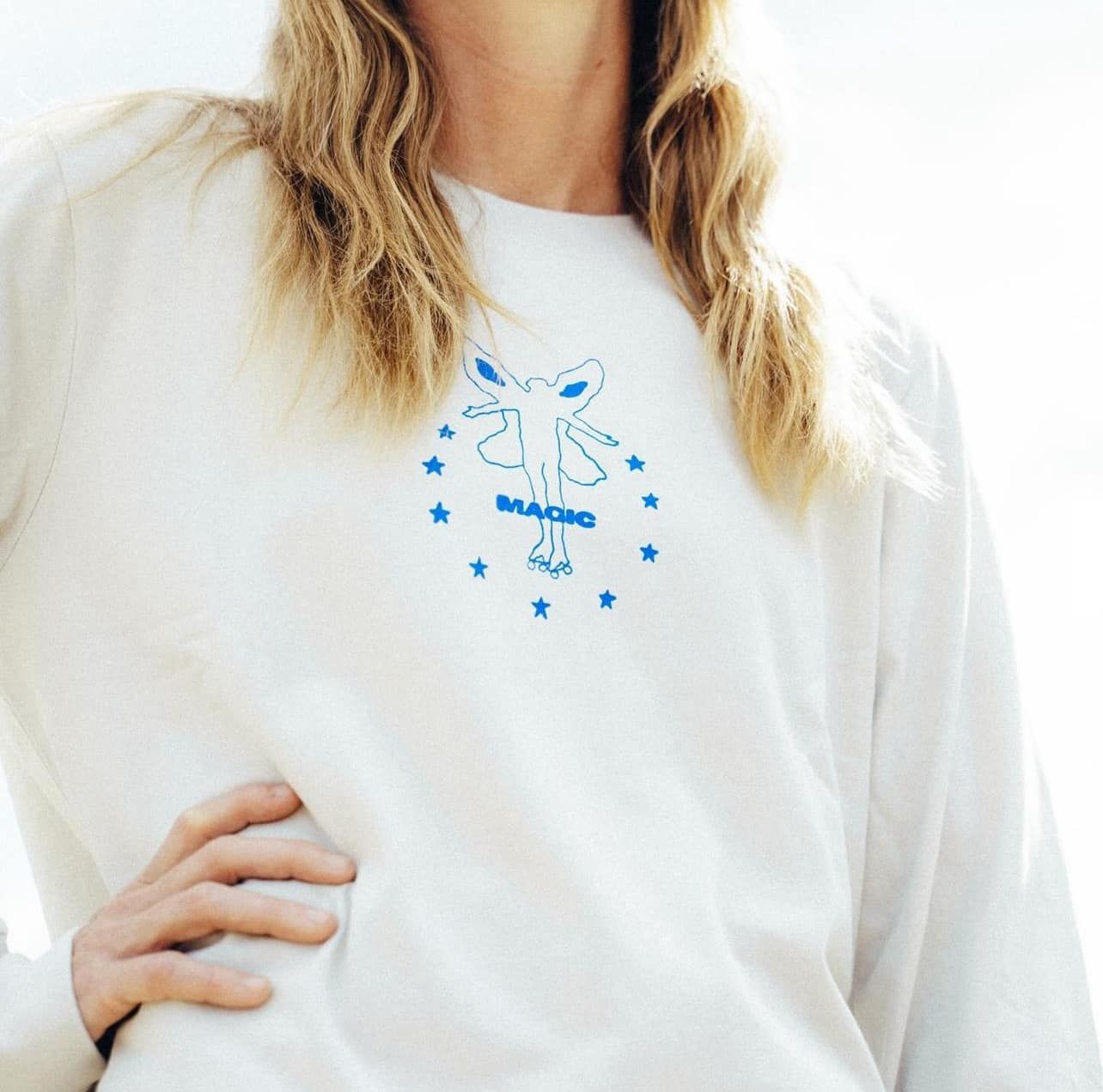 A White Shirt With a Picture of a Woman and the Words Come Sundown — Fab Art in Wallabi Point, NSW