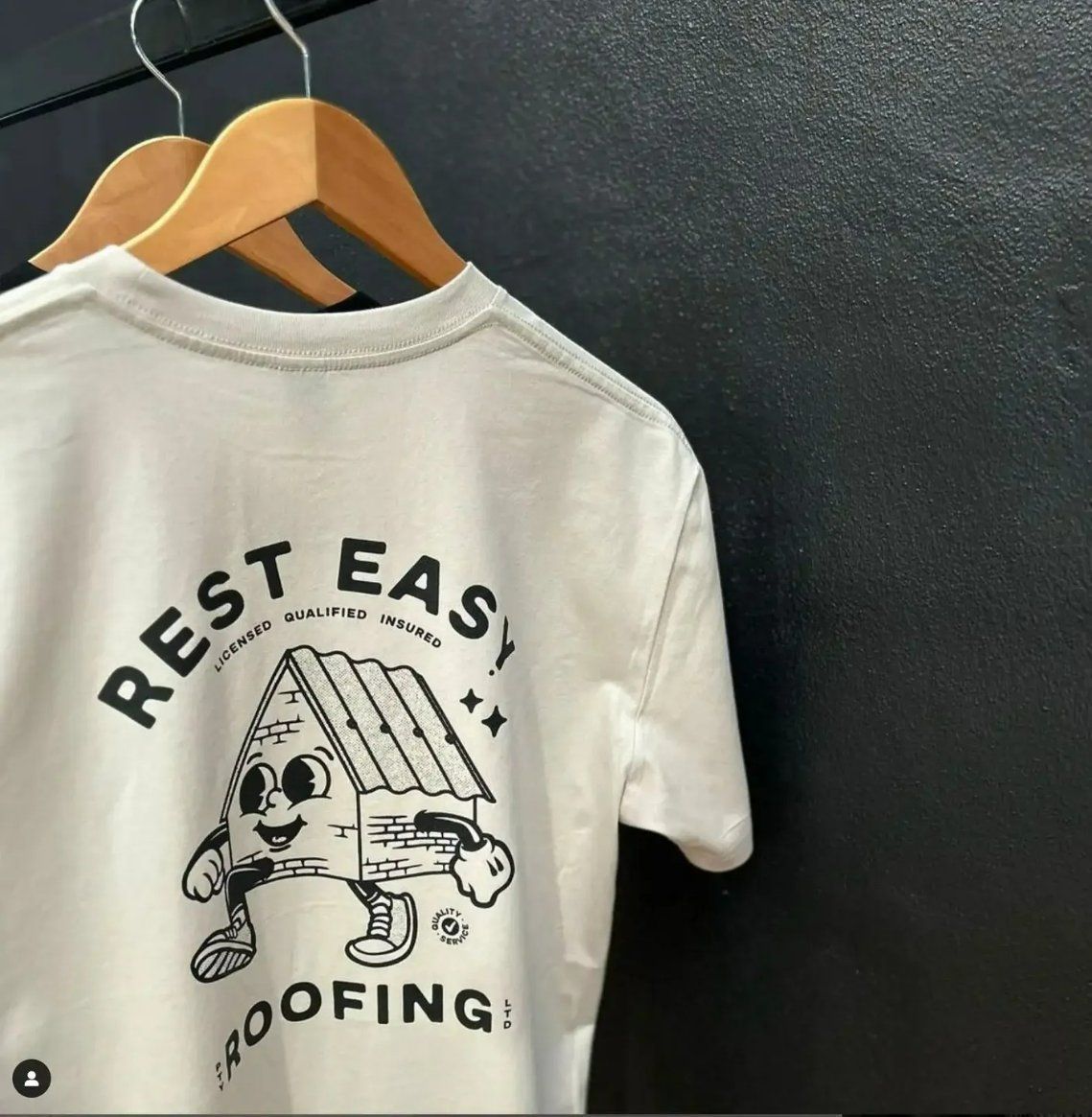 A White T-Shirt that Says Rest Easy Roofing  — Fab Art in Port Macquarie, NSW