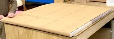 A painting packaged in wrapping paper