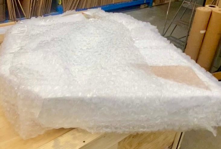 An item wrapped in bubble wrap and wrapping paper