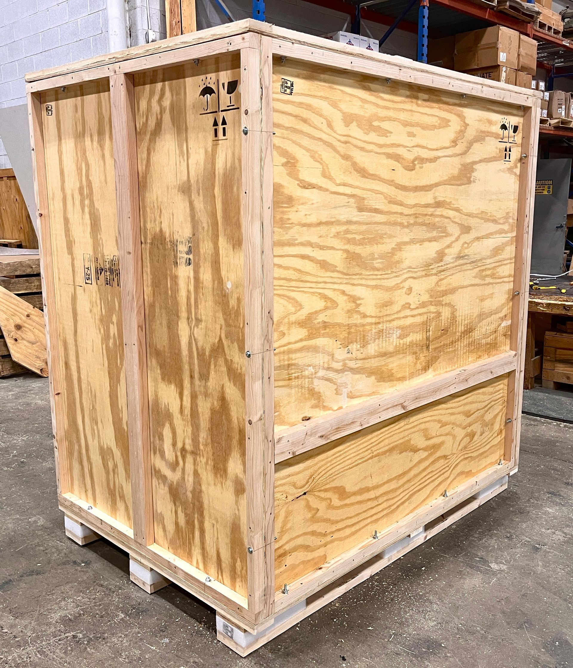 The back and side of a crate we created to protect an SMT.