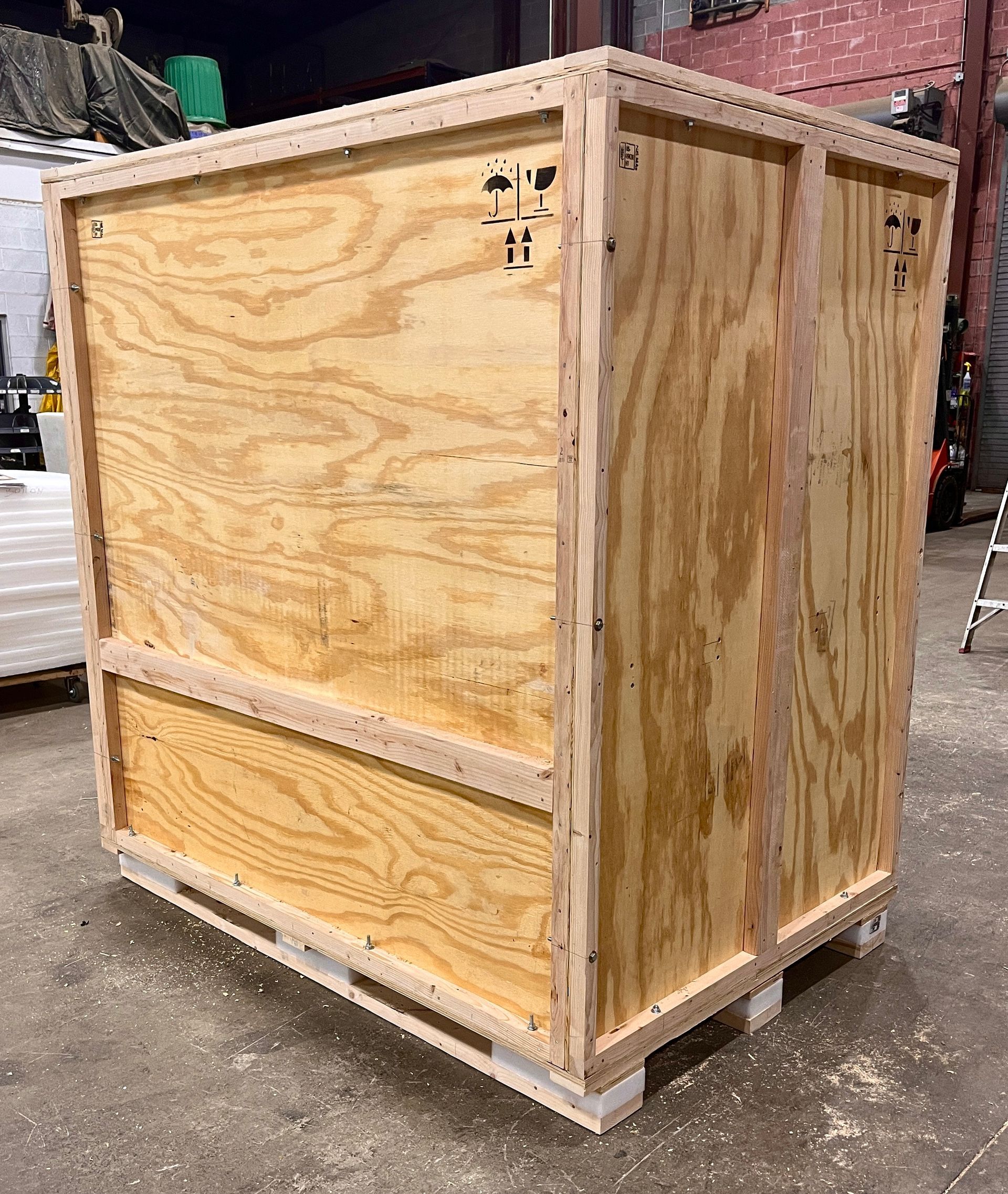 The back and side of a crate we created to protect an SMT.