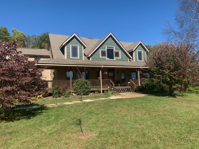 A Large House With A Large Porch In The Middle Of A Lush Green Field – Boone, NC – A Brush Above Painting