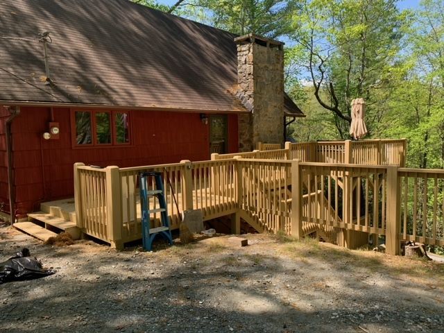 A Wooden Deck Is Being Built In Front Of A Red House – Boone, NC – A Brush Above Painting