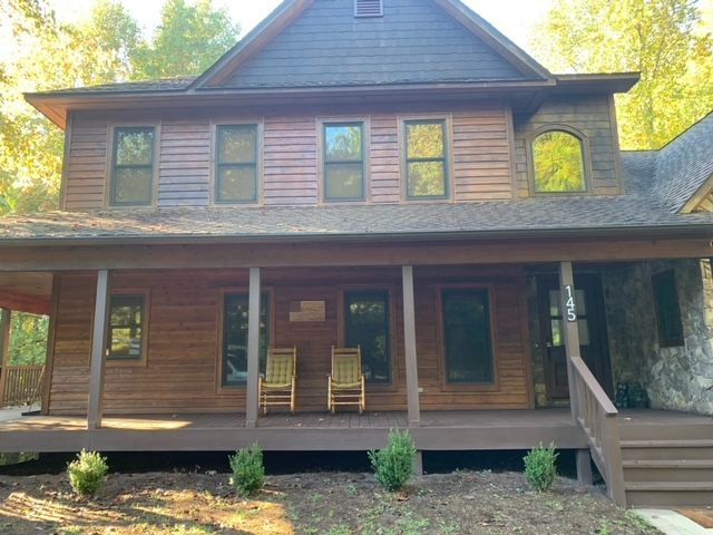 A Large House With A Porch And Chairs On It – Boone, NC – A Brush Above Painting