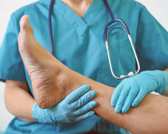 Podiatry Care Center – Doctor Holding Patient’s Leg in West Chester, PA