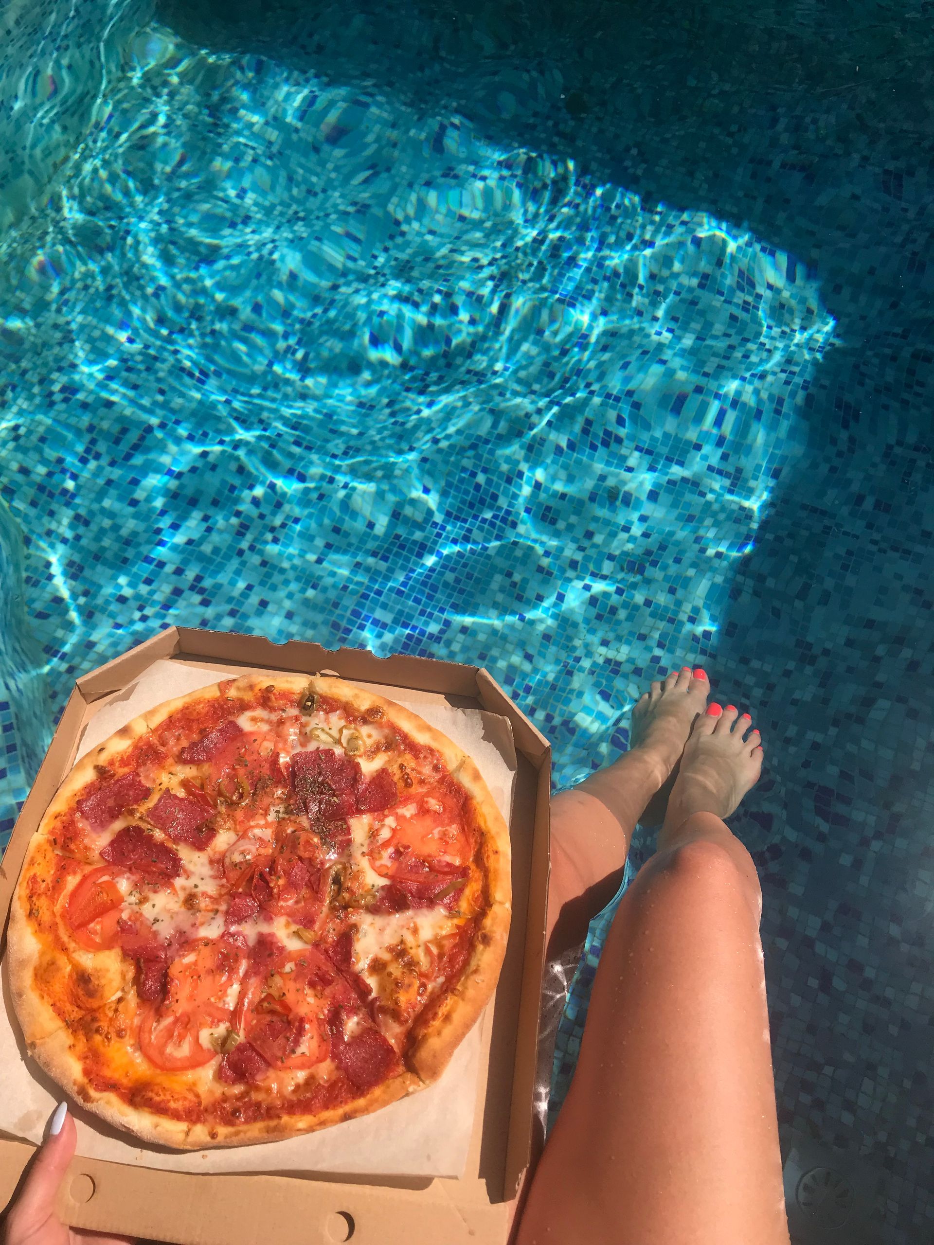 Enjoying Uncle Tony's Pizza at the Eagle Aruba Resort Pool