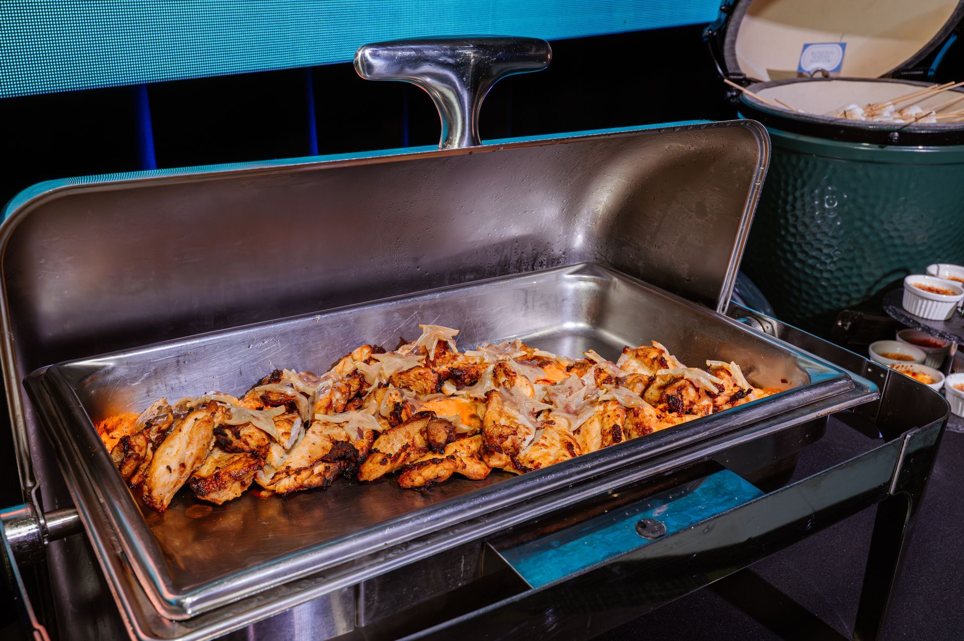 A buffet tray filled with food is sitting on a table.