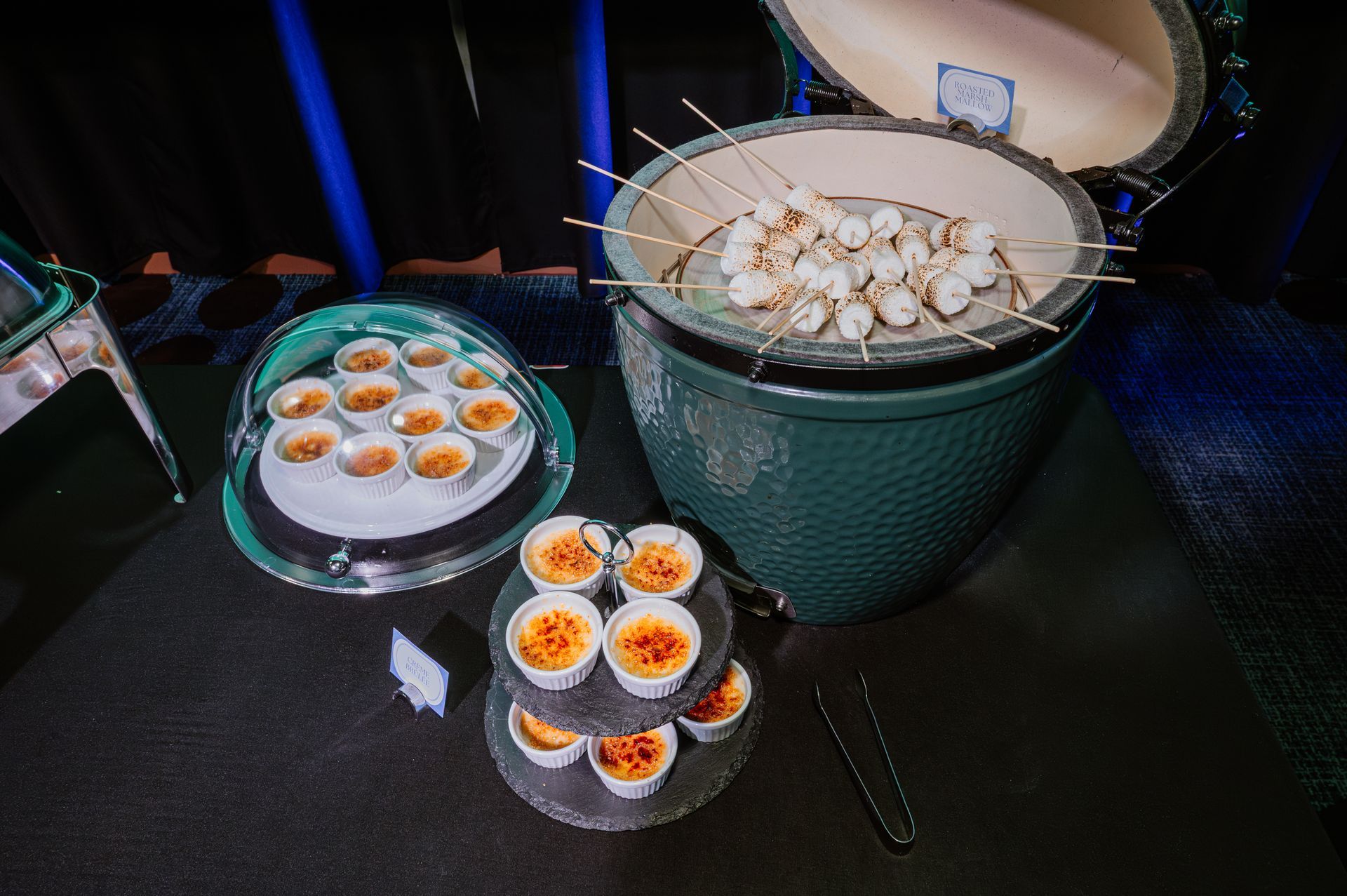 A large green pot filled with food is sitting on a table.
