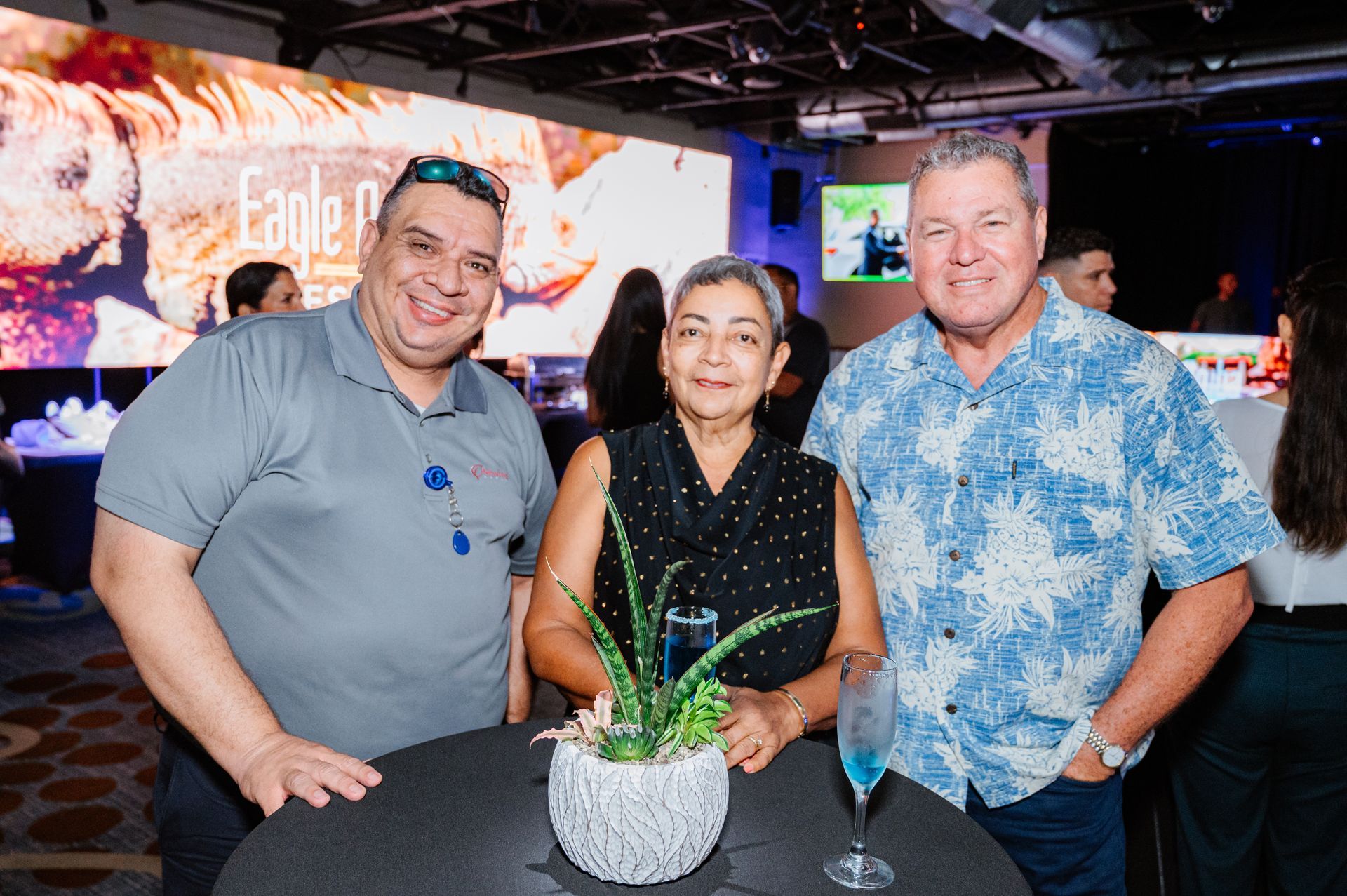 A group of people are posing for a picture at a party.