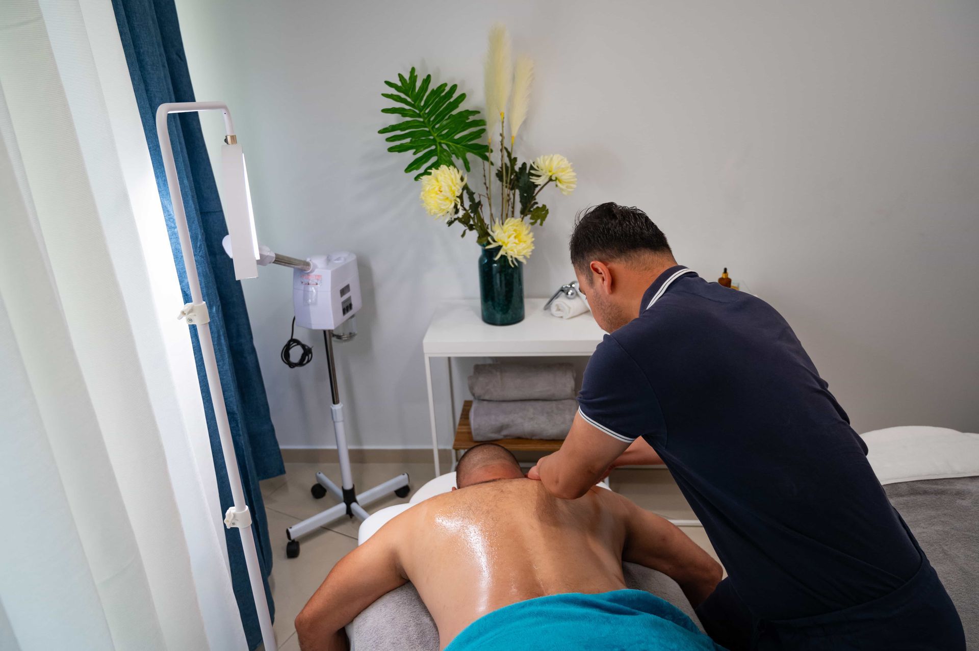 A man is getting a massage at a spa.