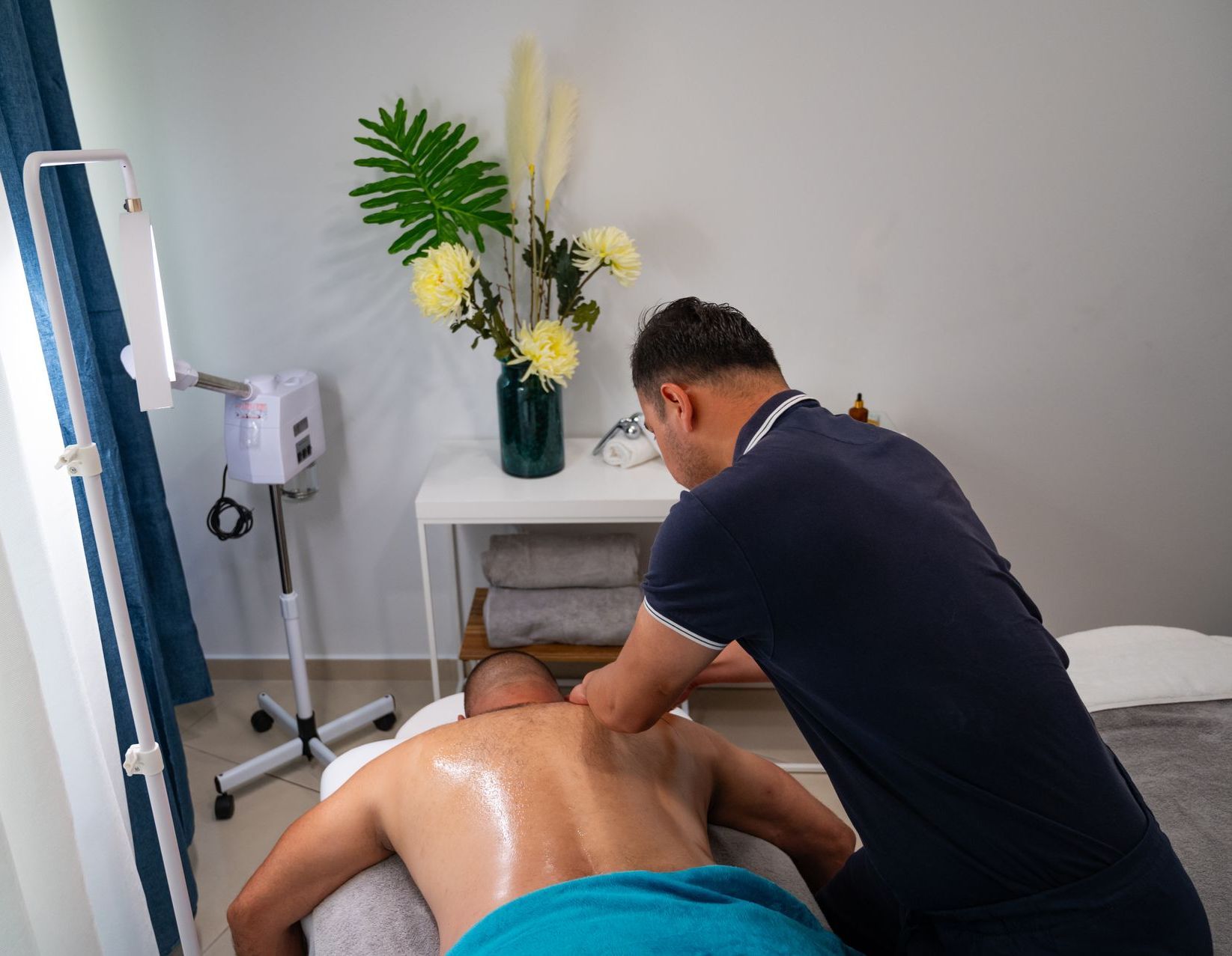 A man is getting a massage in a spa.