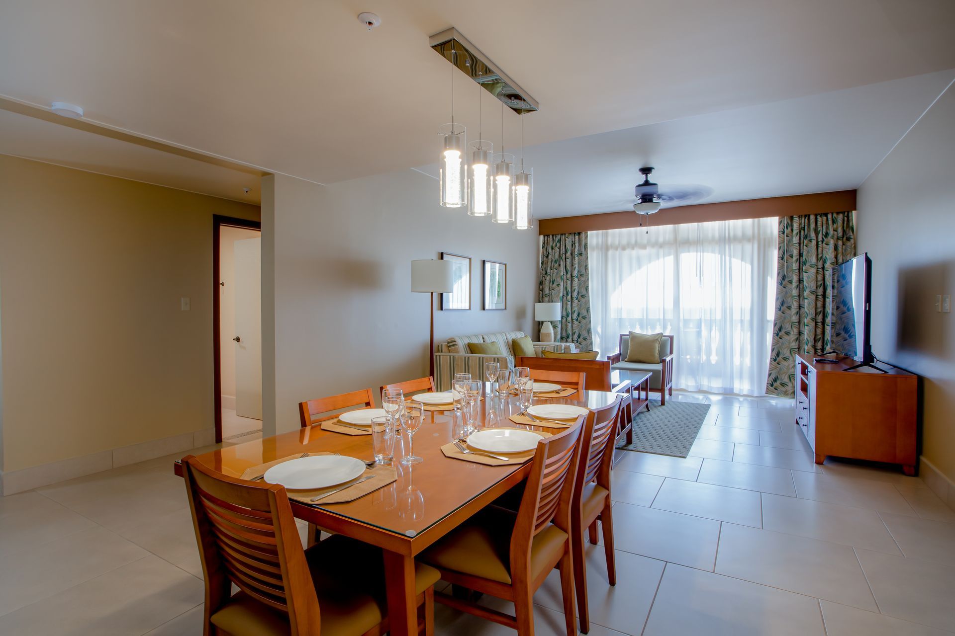 A large room with a dining table and chairs