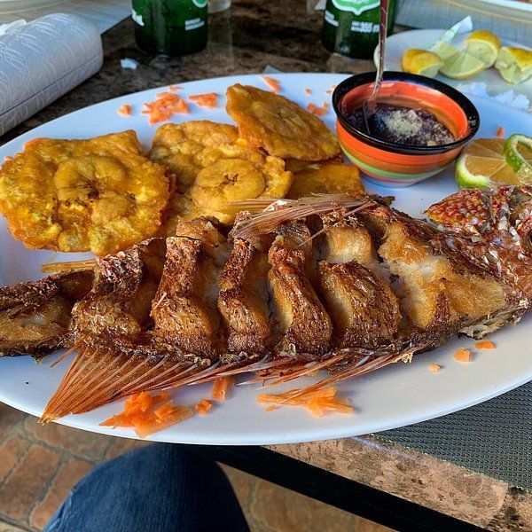An aerial view of a beach with white sand and turquoise water.