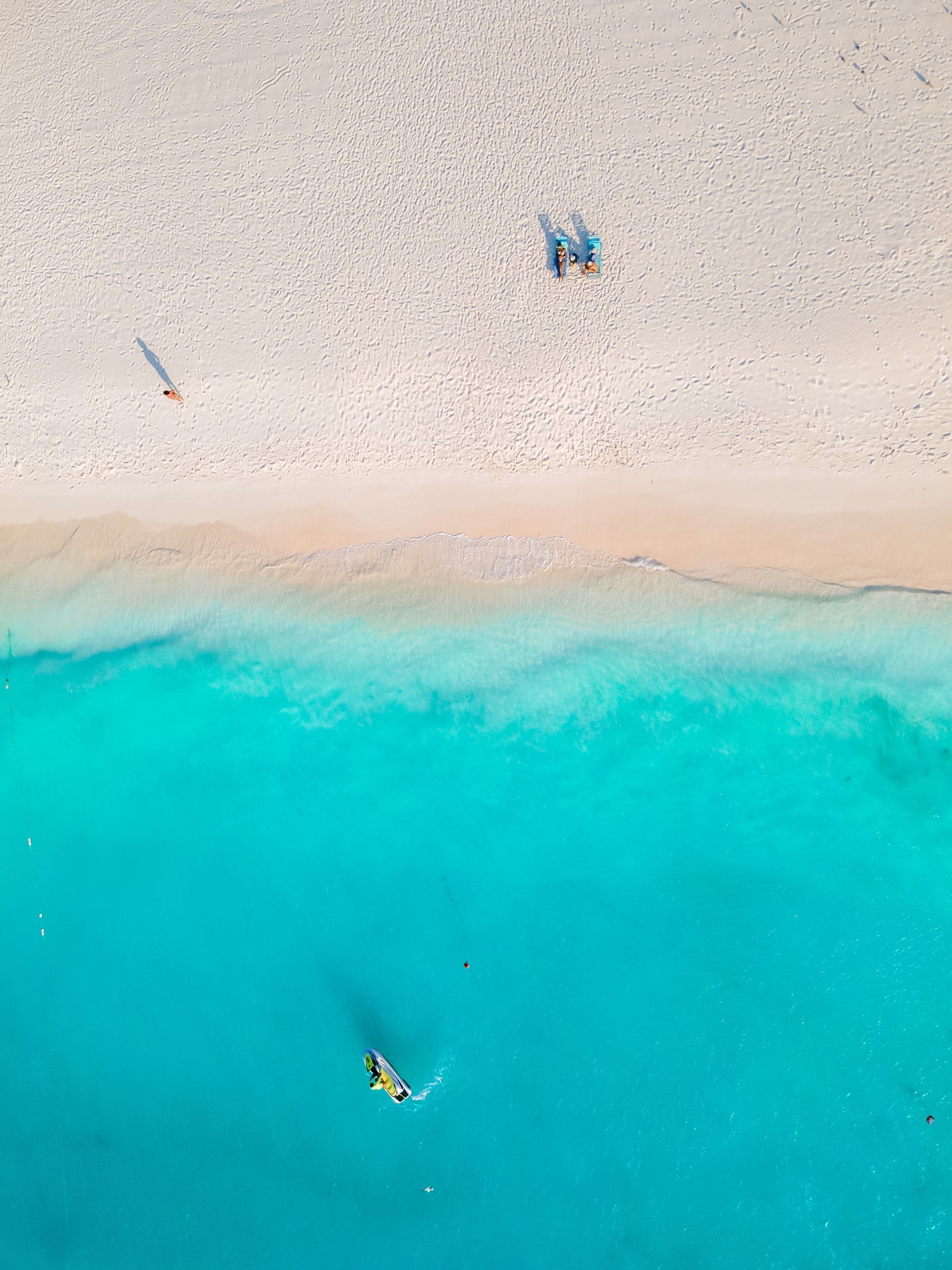 An aerial view of a beach and a body of water.