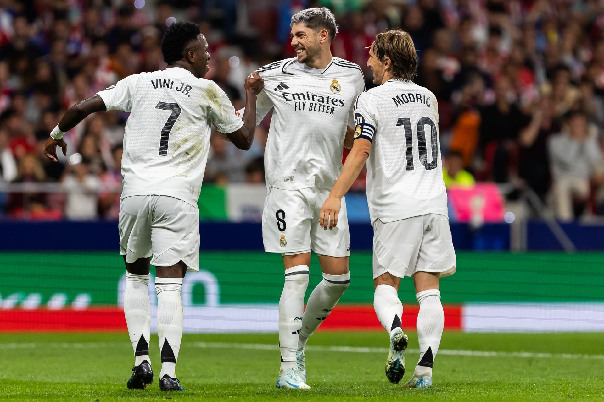 An aerial view of a beach with white sand and turquoise water.