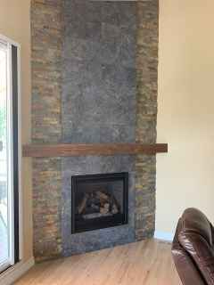 There is a fireplace in the corner of the room.