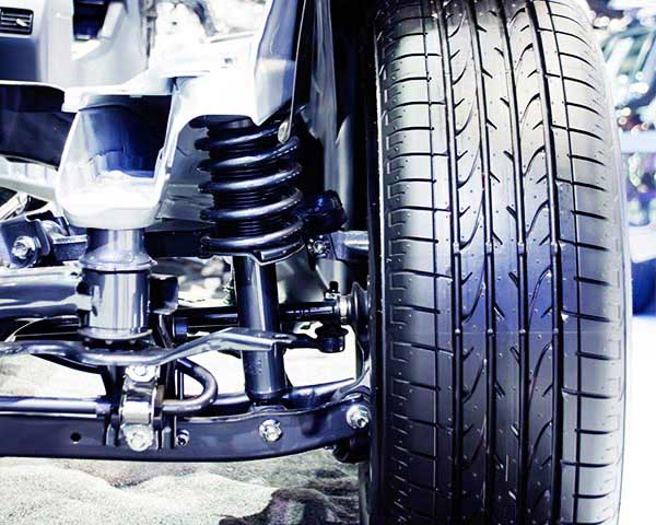 Car with new tire and Shock Absorber - Automotive parts in Rochester MN