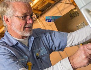 Furnace Repair — Man Repairing a Furnace in Nashville, TN