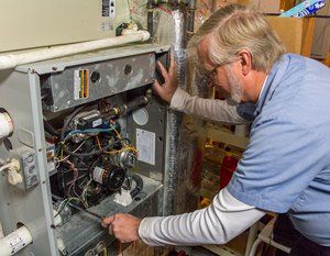 Heating Repair — Man Repairing the Heater in Nashville, TN