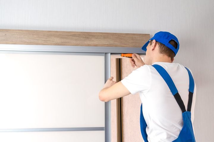 Man Repairing Sliding Door — Slide EZ Doors in Invermay, TAS