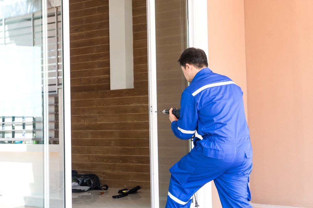 Man Repairing Sliding Door Lock — Sliding Door & Window Repairs in Devonport, TSA