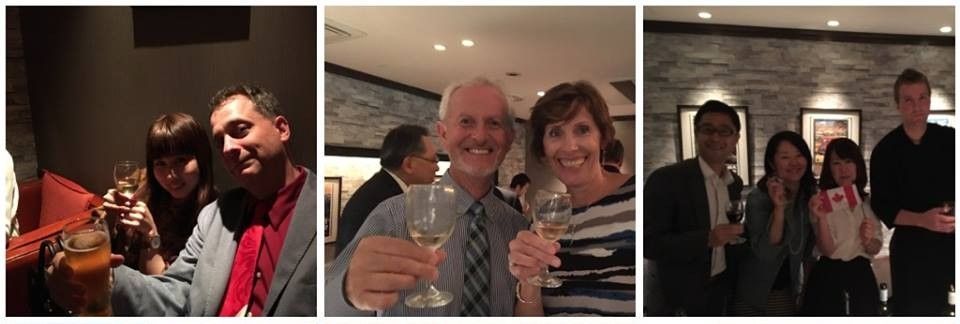 People toasting drinks in restaurant.