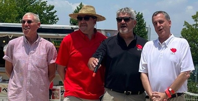 Four Canadian men singing o Canada in Kariya, Japan.