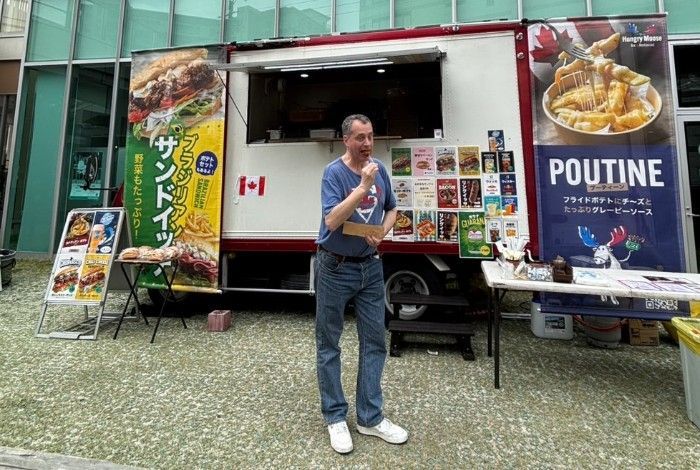 A Canadian eating poutine in Kasugai Japan.