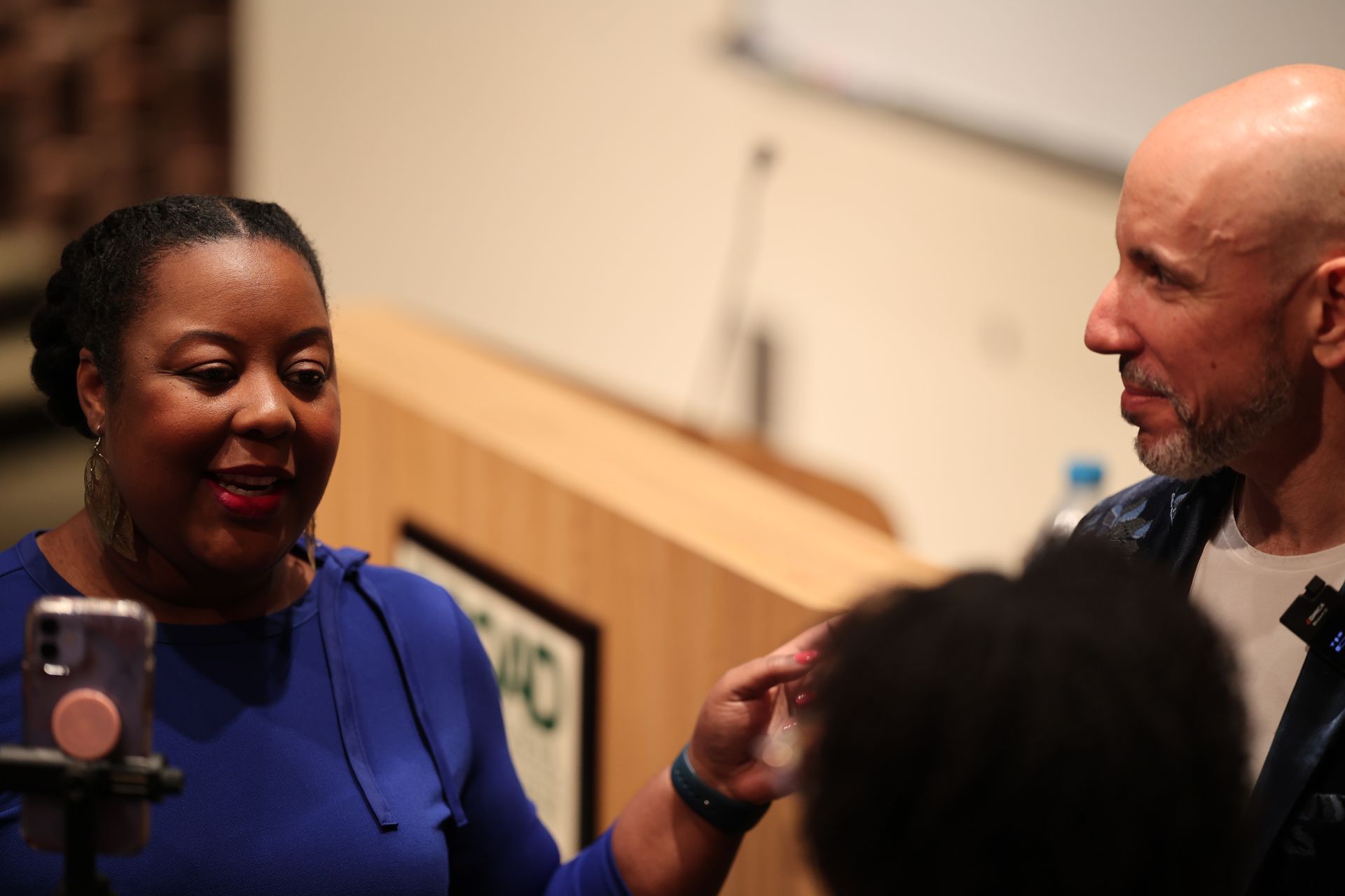 Philomena talking with Conference goers