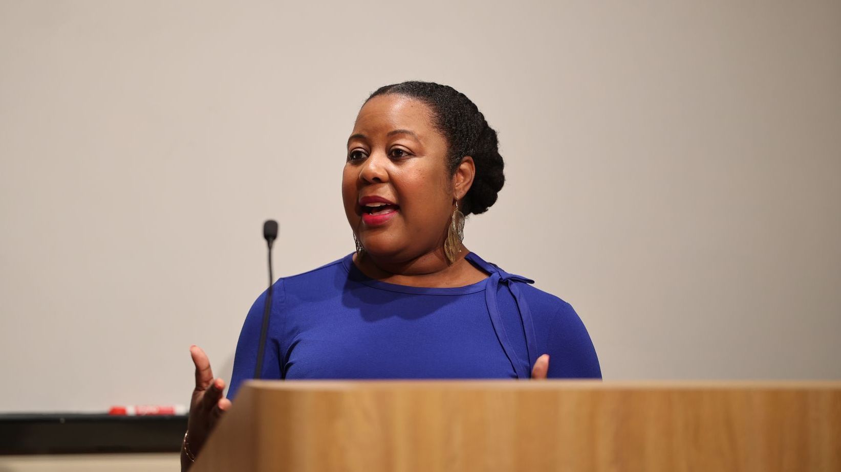 Speaker Philomena inspiring business owners at a conference