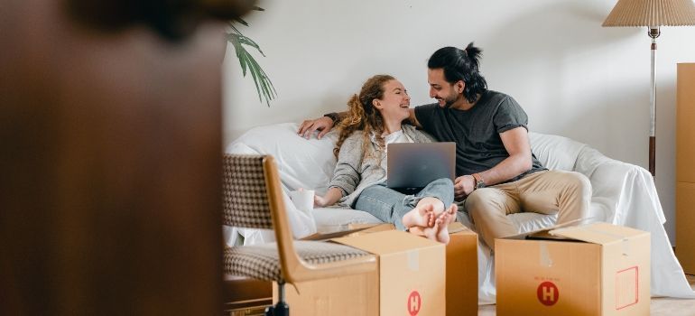 couple looking at their laptop and smiling